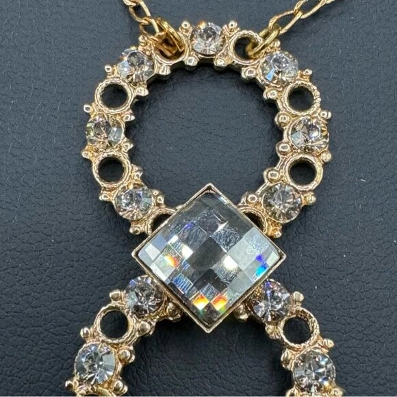 Belladonna Circular Crystal and Gold Tone Infinity Pendant Necklace - Picture 12 of 17